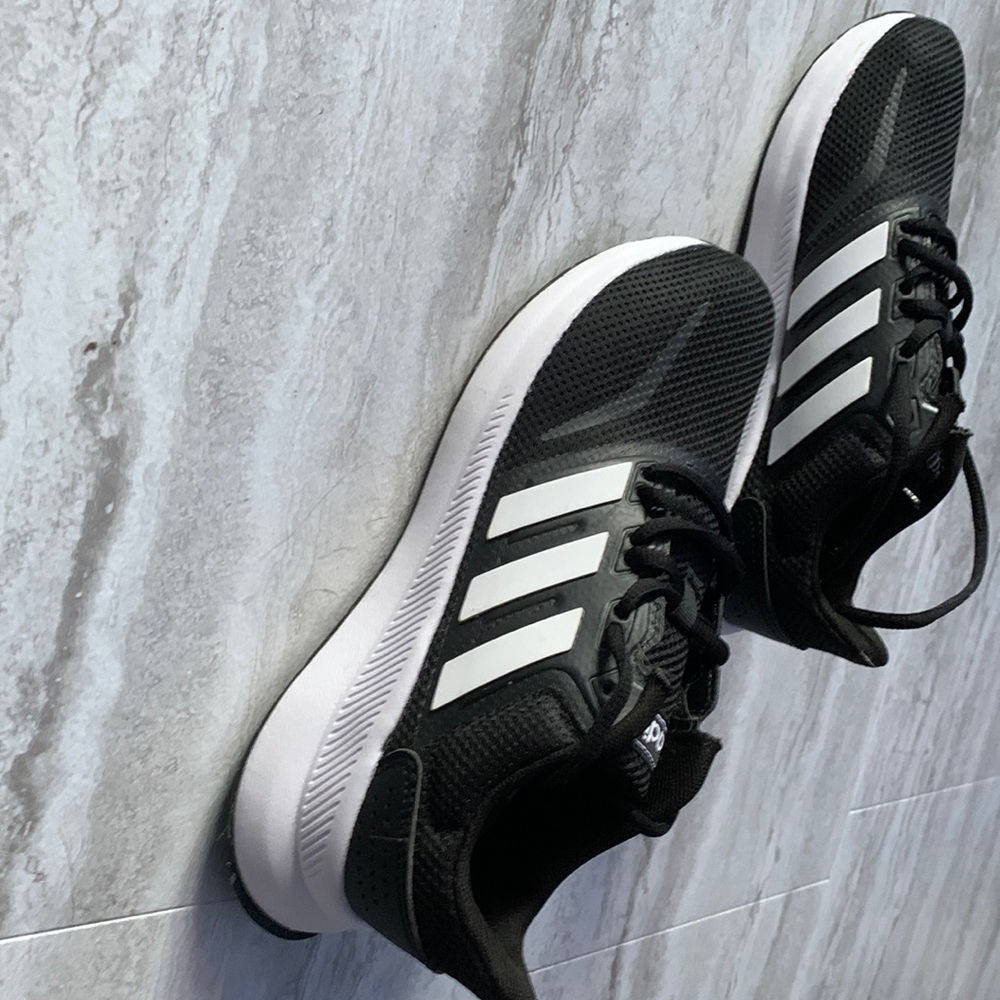 Brand new, never worn , size 4 (kids) black and white adidas